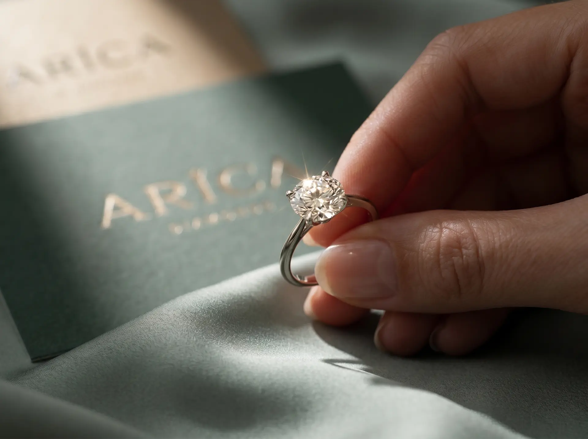 Arica Diamonds business card with diamond