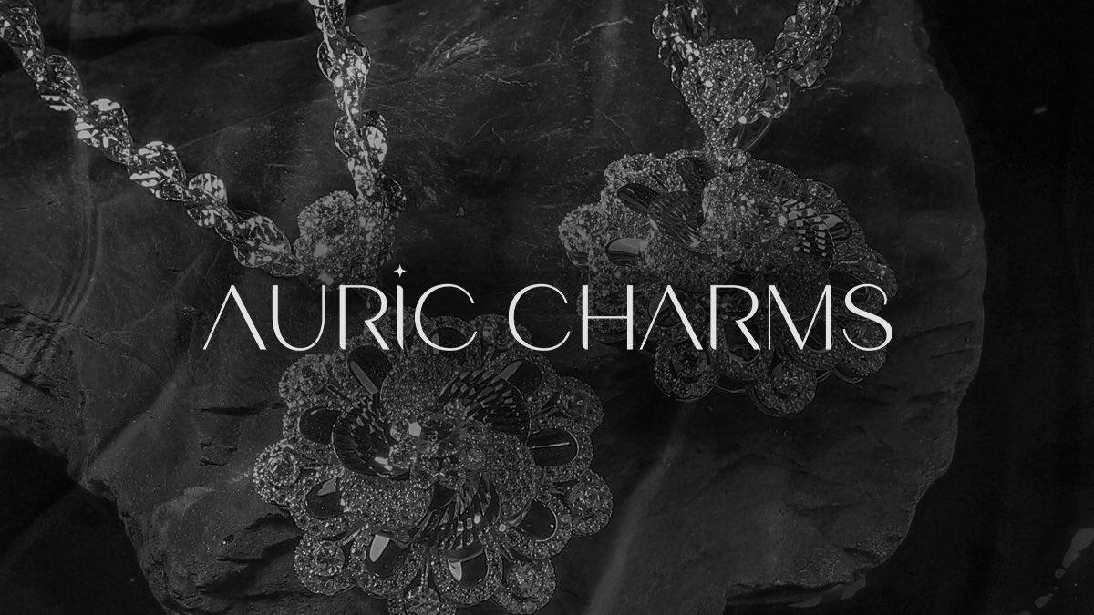 Auric Charms logo on dark background
